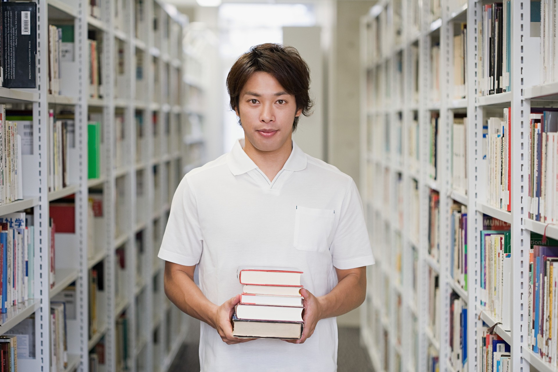 Young man in library